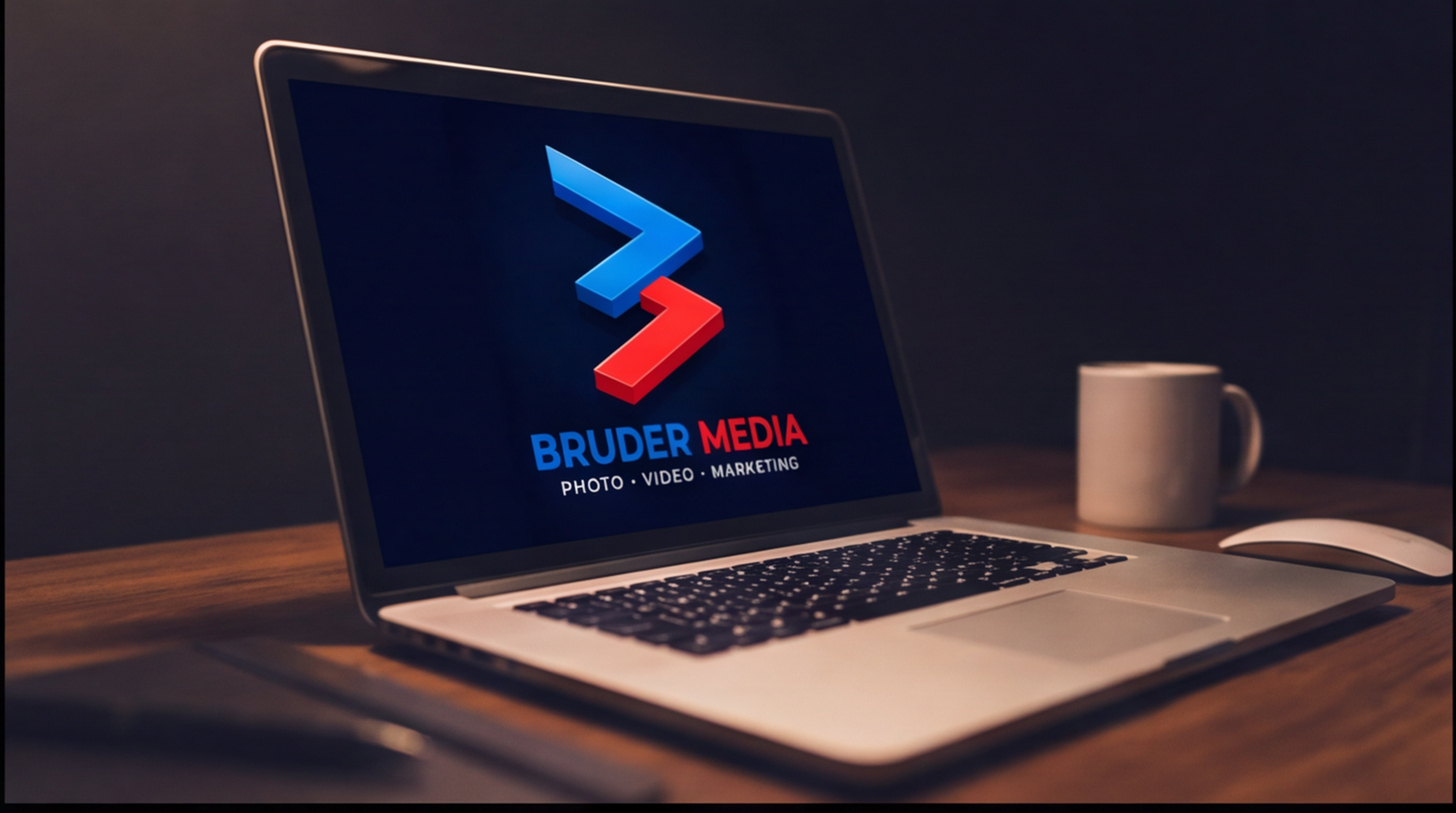 Angled hero shot of a laptop displaying the Bruder Media logo